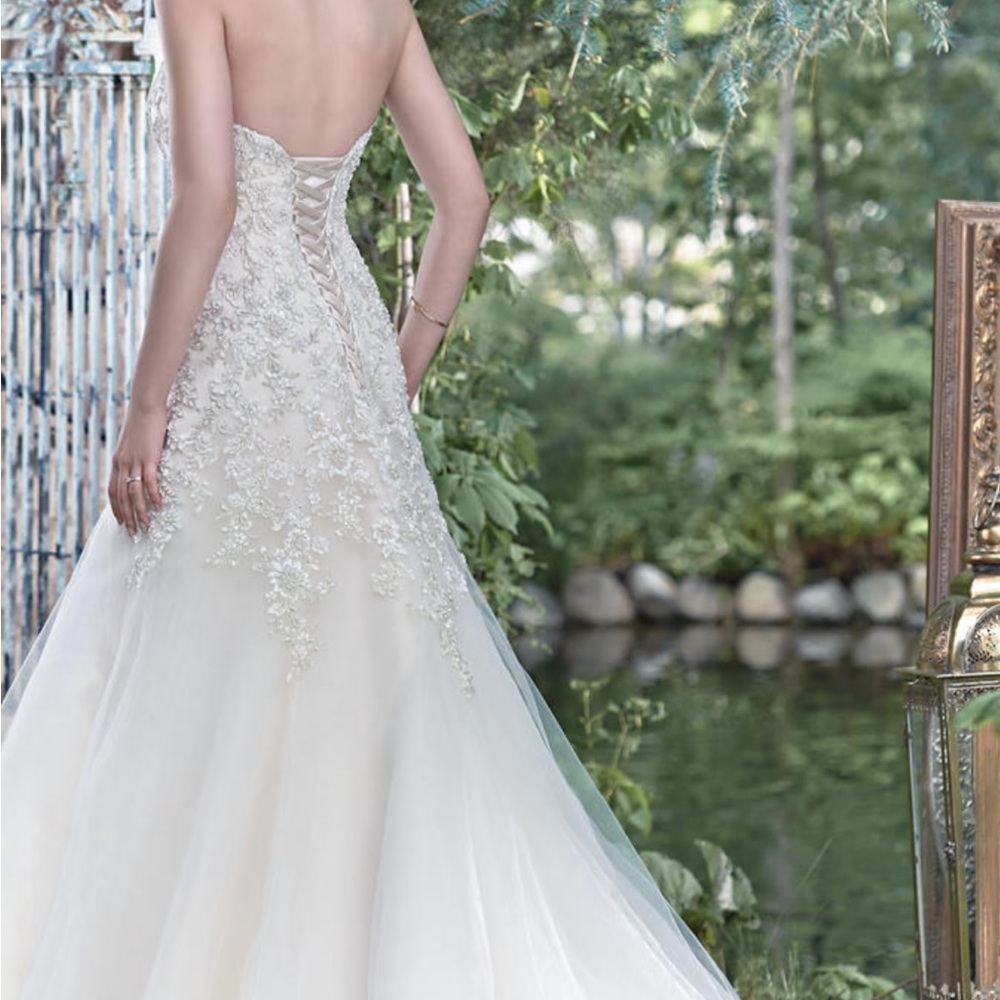 Maggie Sottero Ivory Ball Gown with Silver Beaded Bodice - Picture 8 of 11